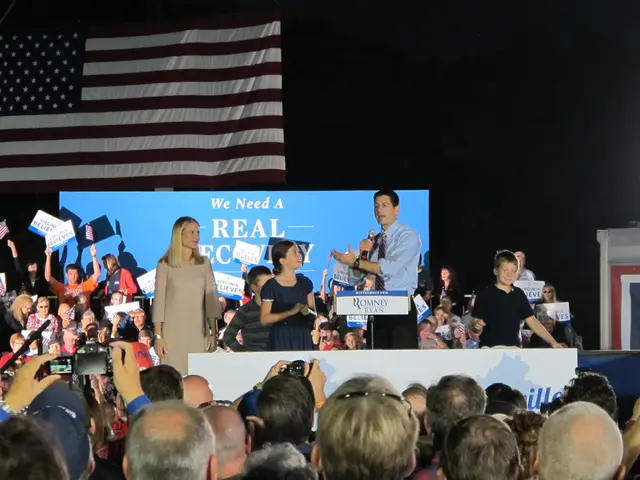 This image consists of so many people. There are some people who are clicking pictures and some are...