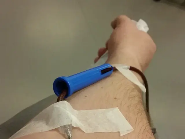 Background portion of the picture is in white color. In this picture we can see a person's hand...