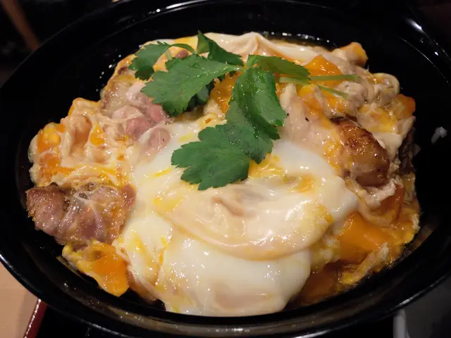 This image consists a bowl in which there are omelettes and flesh along with leaves.